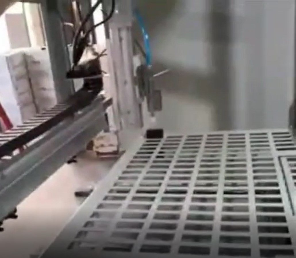 Real project video frame showing the robotic key-cabinet mechanism